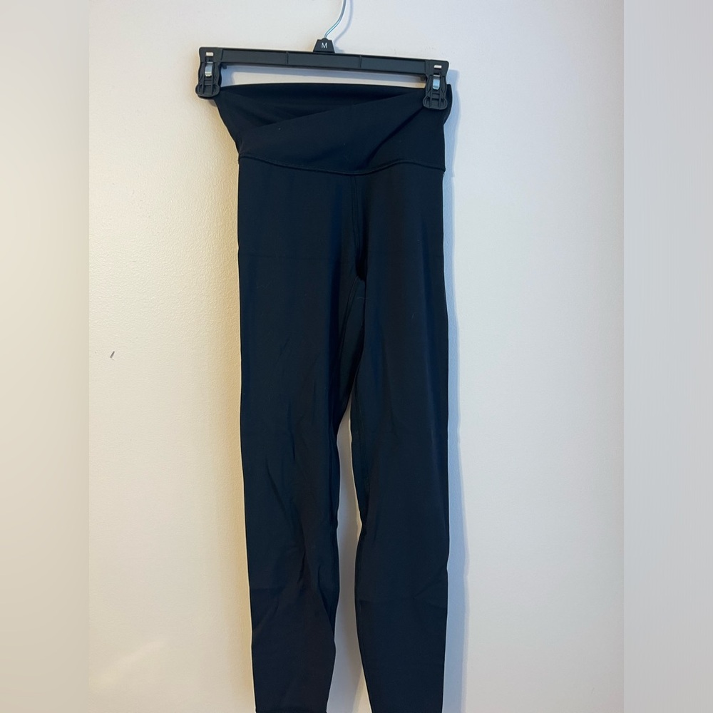 cross top black leggings